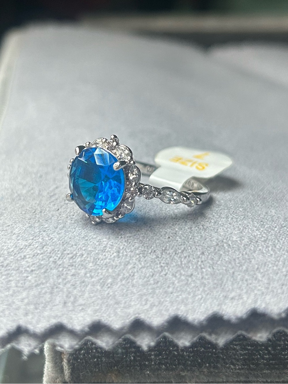 Sterling Silver Halo Ring with Vivid Blue Center Stone